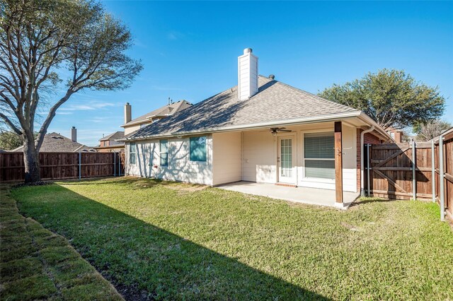 back of house featuring a yard, ceiling fan, and a patio area