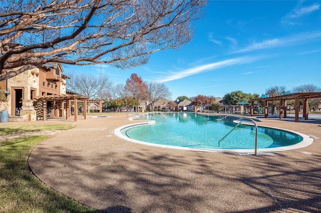 view of swimming pool featuring a patio area