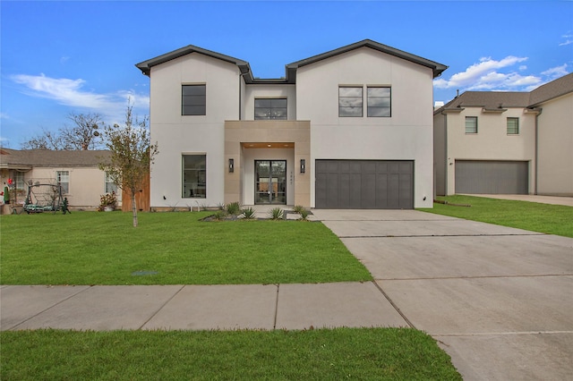 contemporary house with a garage and a front yard