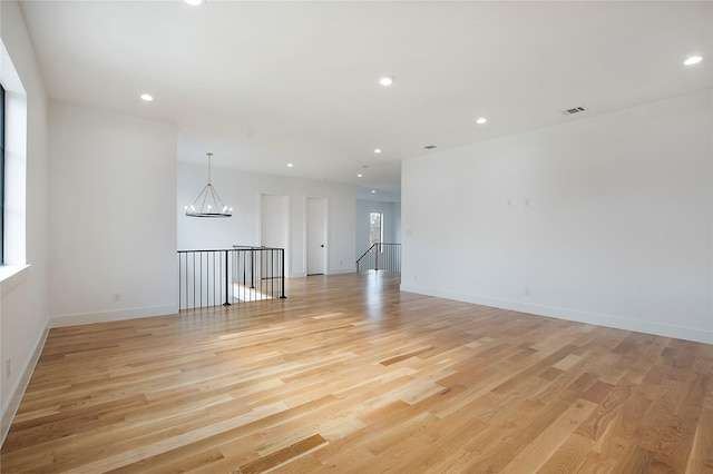 unfurnished room with light hardwood / wood-style flooring