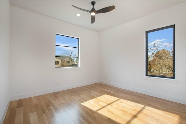 unfurnished room featuring ceiling fan and light wood-type flooring