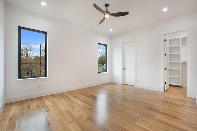 unfurnished bedroom featuring ceiling fan and light hardwood / wood-style flooring