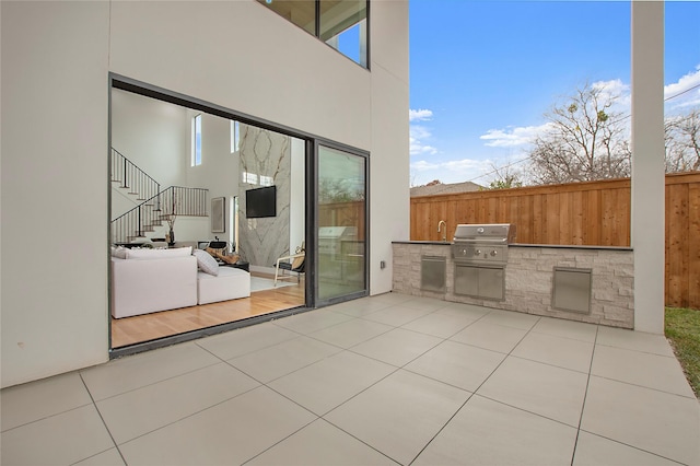 view of patio / terrace with an outdoor kitchen and area for grilling