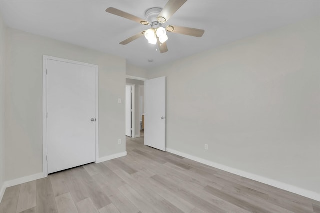 unfurnished bedroom featuring ceiling fan and light wood-type flooring