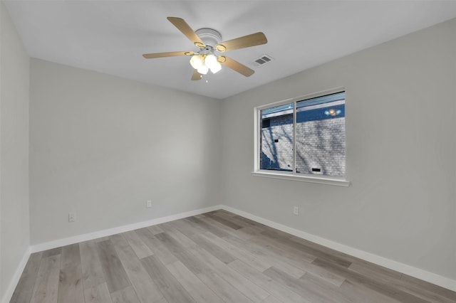 spare room with light hardwood / wood-style floors and ceiling fan