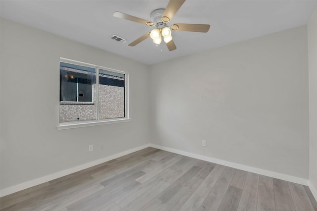 unfurnished room with ceiling fan and light wood-type flooring