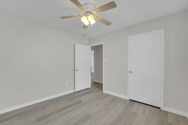 unfurnished bedroom featuring light hardwood / wood-style flooring and ceiling fan