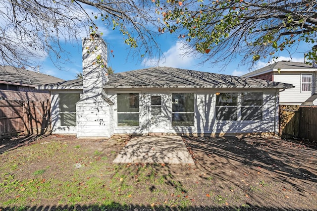 rear view of property with a patio area