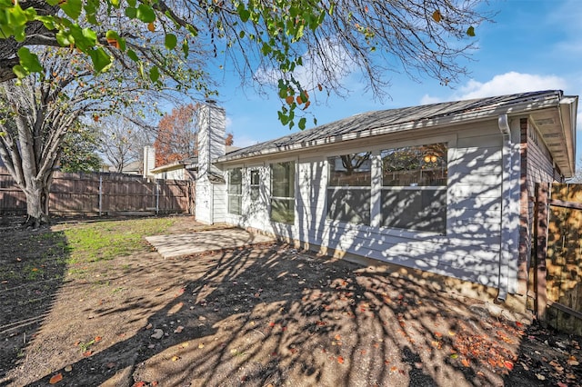 rear view of house featuring a patio