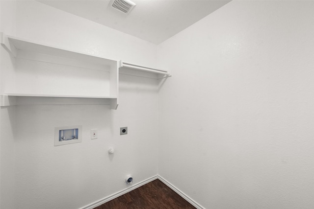 laundry room featuring electric dryer hookup, gas dryer hookup, hardwood / wood-style floors, and washer hookup