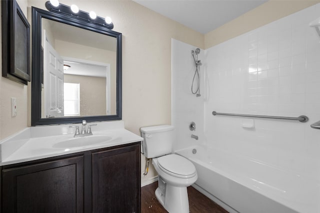 full bathroom featuring vanity, toilet, wood-type flooring, and bathtub / shower combination