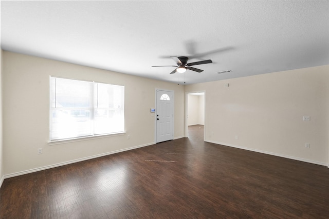 interior space featuring ceiling fan and dark hardwood / wood-style flooring