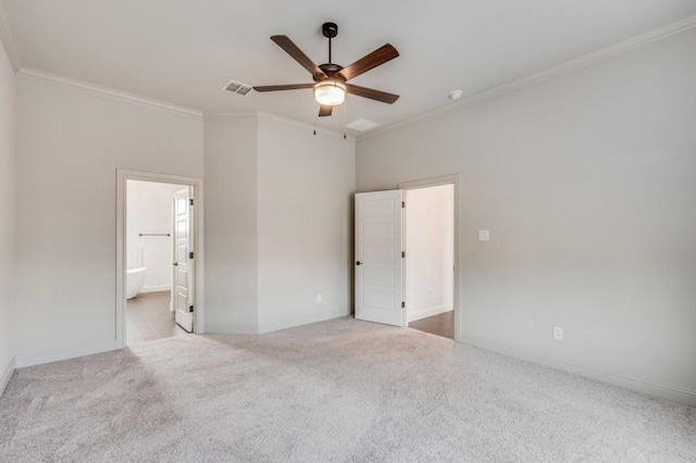 unfurnished bedroom featuring ceiling fan, light carpet, ensuite bathroom, and ornamental molding