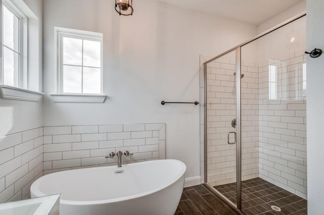 bathroom with separate shower and tub