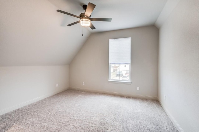 additional living space with ceiling fan, lofted ceiling, and carpet floors