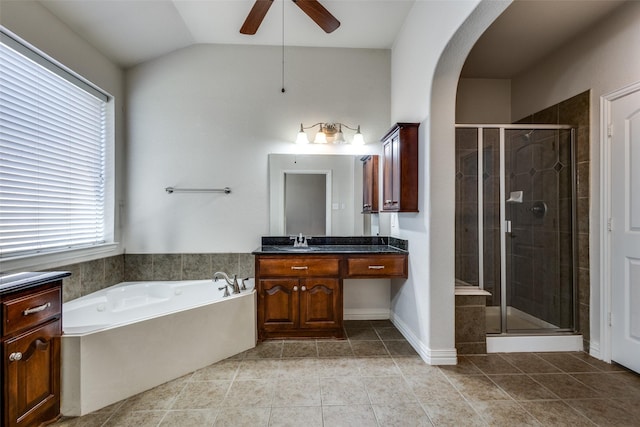 bathroom featuring shower with separate bathtub, vanity, ceiling fan, and lofted ceiling