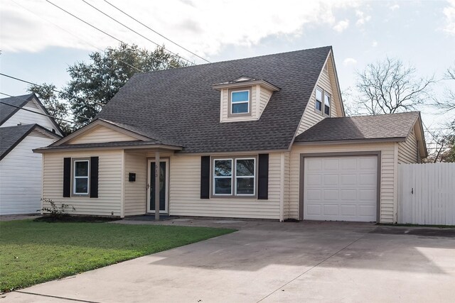 view of front facade with a garage and a front yard