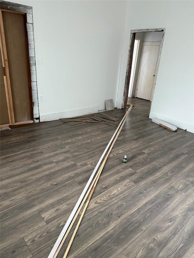 spare room featuring dark hardwood / wood-style flooring