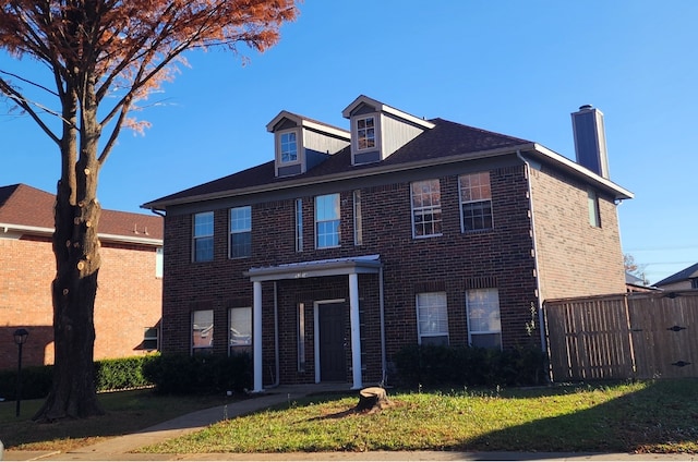 view of front of property with a front lawn