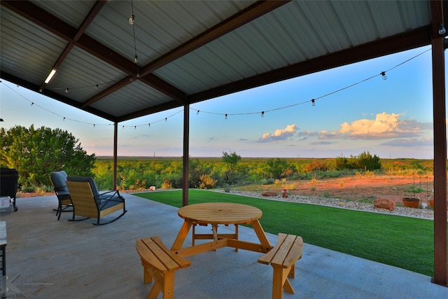 patio terrace at dusk with a lawn