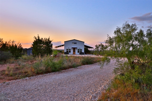 view of front of home with an outdoor structure