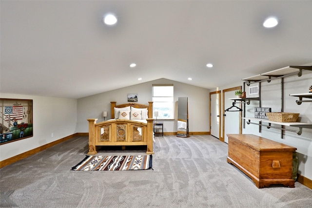 bedroom featuring carpet and lofted ceiling