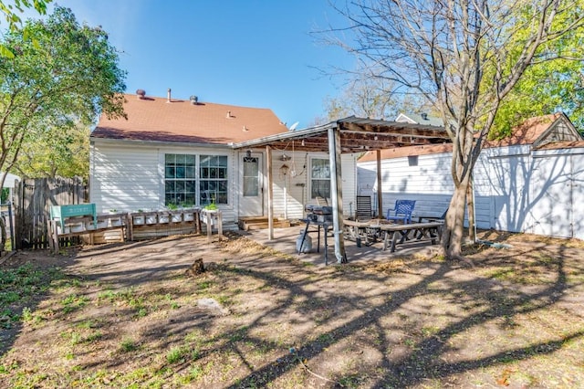 back of house with a patio area