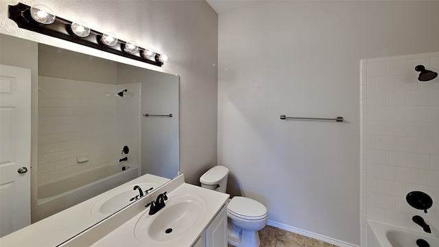 full bathroom with tile patterned floors, toilet, vanity, and tiled shower / bath