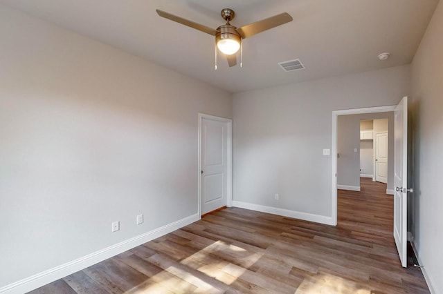 unfurnished bedroom featuring ceiling fan and light wood-type flooring