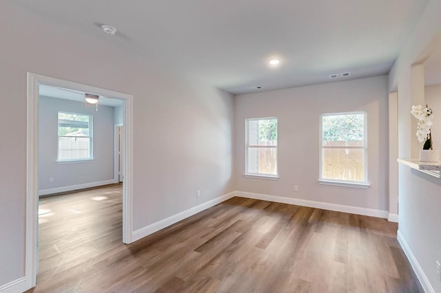 spare room with wood-type flooring