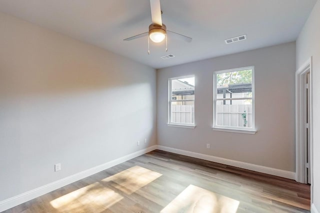 spare room with ceiling fan and light hardwood / wood-style flooring