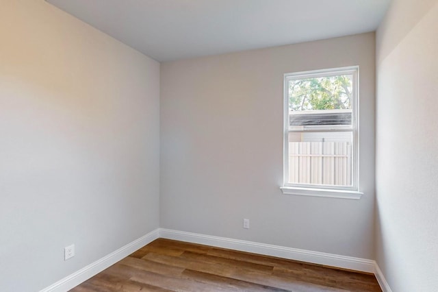 spare room with hardwood / wood-style floors