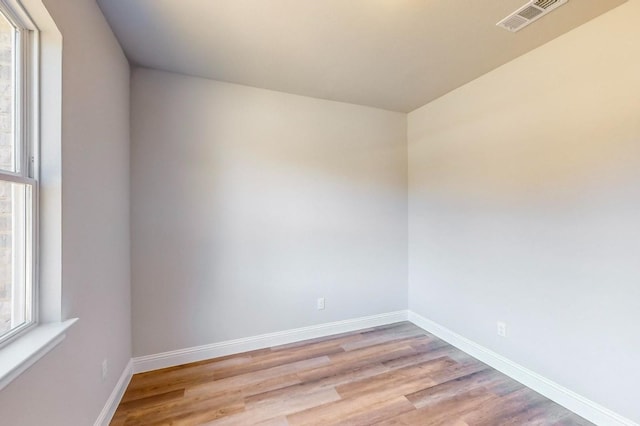 spare room with light hardwood / wood-style floors