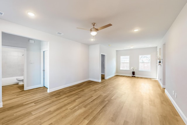 spare room with ceiling fan and light hardwood / wood-style flooring