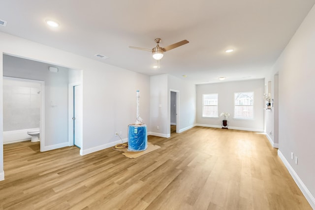 interior space with light wood-type flooring and ceiling fan