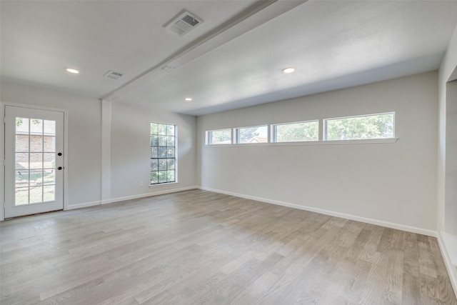 empty room with light hardwood / wood-style floors