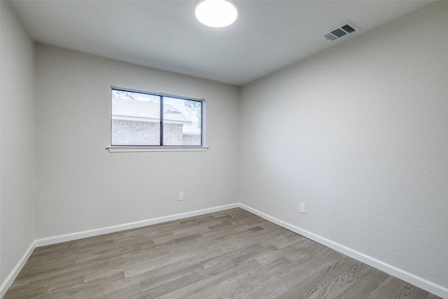 unfurnished room featuring light hardwood / wood-style floors