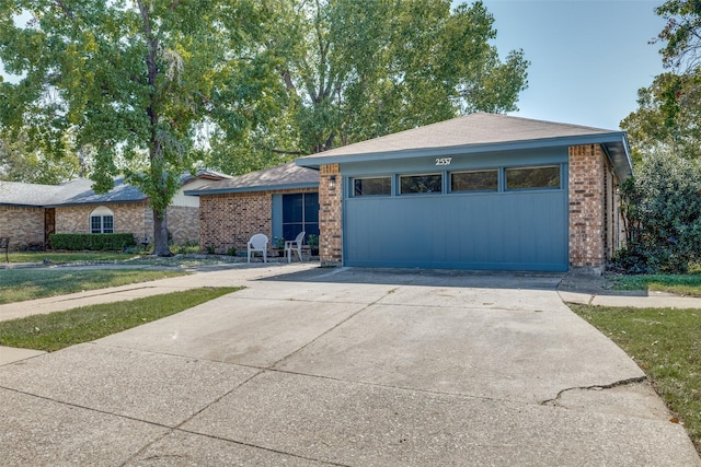 ranch-style home featuring a garage