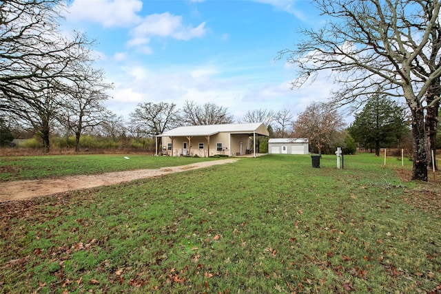 exterior space with a front lawn and a carport