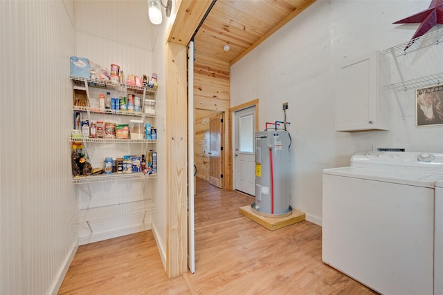 washroom featuring washer / clothes dryer, wooden ceiling, electric water heater, and light wood-type flooring