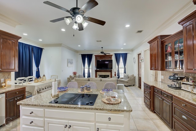 kitchen featuring white cabinetry, crown molding, and black electric cooktop