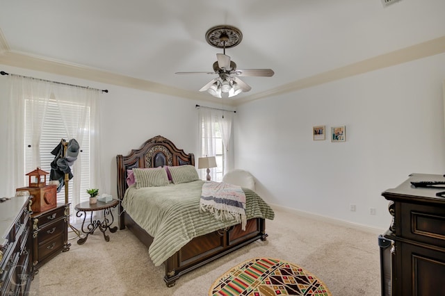 carpeted bedroom with ceiling fan and ornamental molding