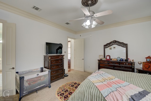 carpeted bedroom featuring ceiling fan and ornamental molding