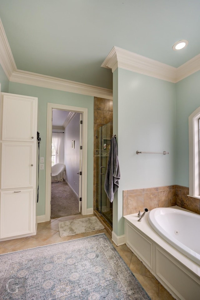 bathroom with tile patterned flooring, ornamental molding, and separate shower and tub