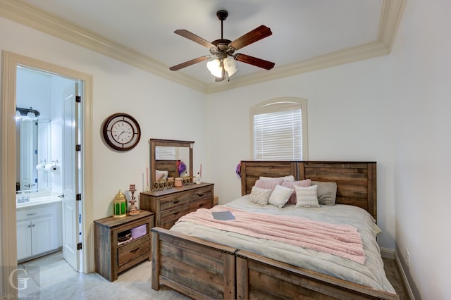 bedroom with ceiling fan, sink, crown molding, and ensuite bath