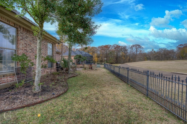 view of yard featuring a lanai