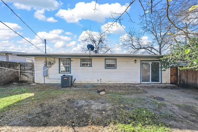 back of house featuring central AC unit