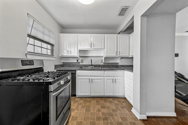 kitchen with white cabinetry, stainless steel range with gas cooktop, and sink