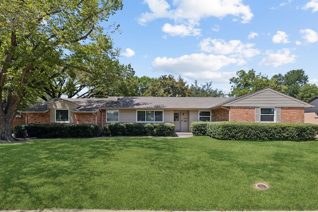 ranch-style house featuring a front lawn