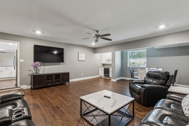 living room featuring wine cooler, dark hardwood / wood-style flooring, and ceiling fan